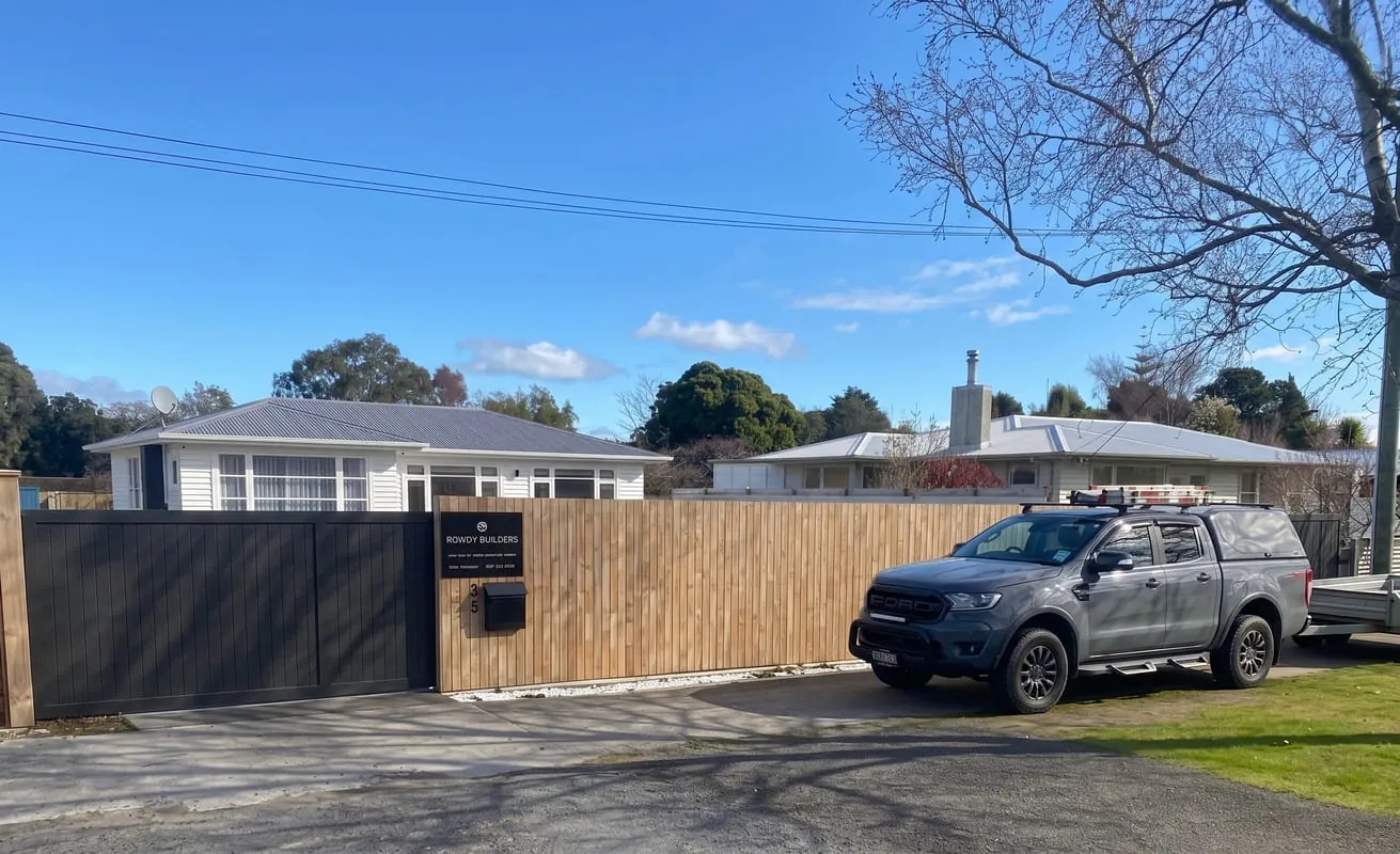 Rowdy Builders ute parked beside a new timber fence and gate, Palmerston North
