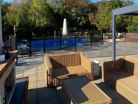 Black aluminium pool fence around a pool and patio, Palmerston North