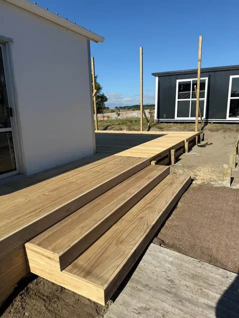 Wide treated pine deck steps beside a house, Palmerston North