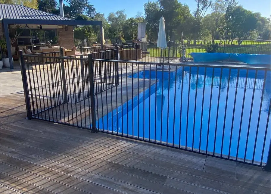 Timber pool deck with a black aluminium pool fence, Palmerston North