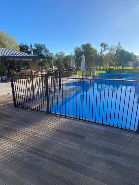 Timber deck boards beside a fenced pool, Palmerston North
