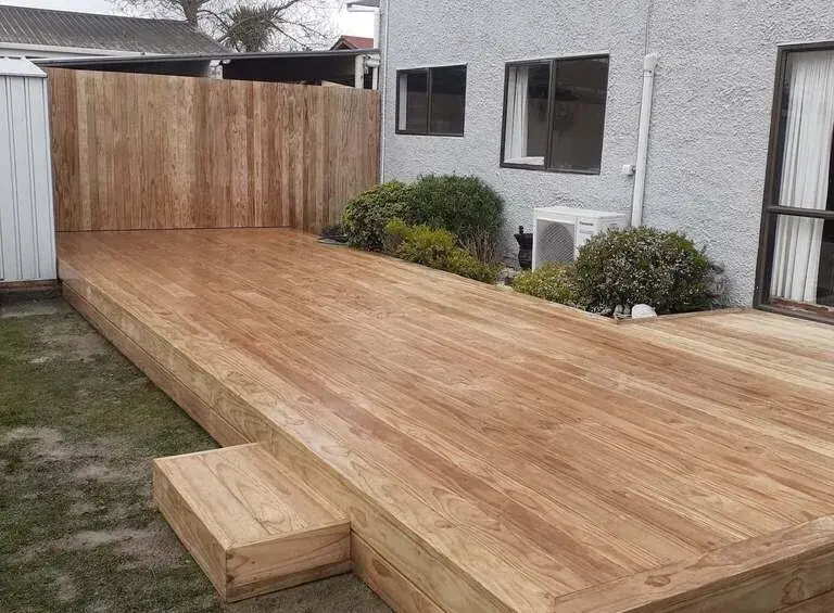 Timber deck with a single step against a screen fence, Palmerston North