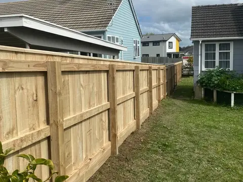 Timber fence with exposed rails along a section, Palmerston North