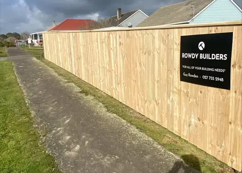 New paling fence with a Rowdy Builders sign, Palmerston North